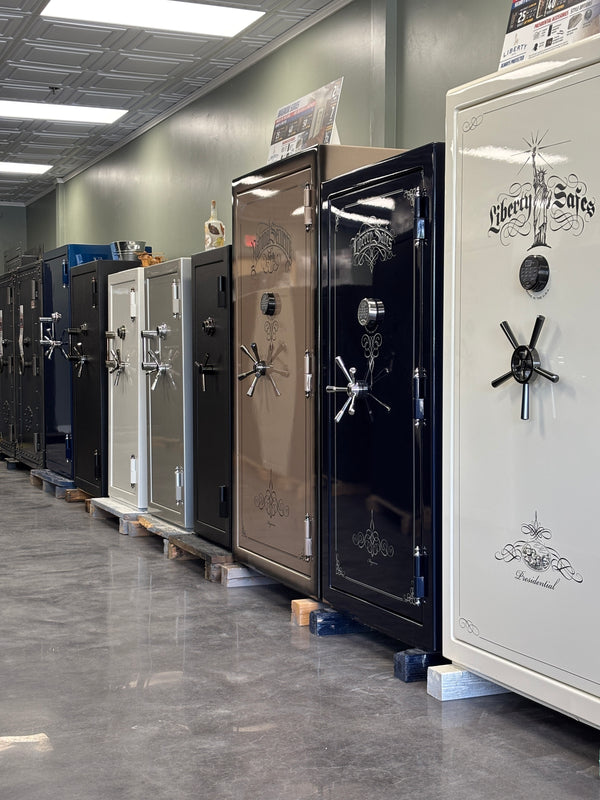 Row of Liberty Safes on display in a showroom.